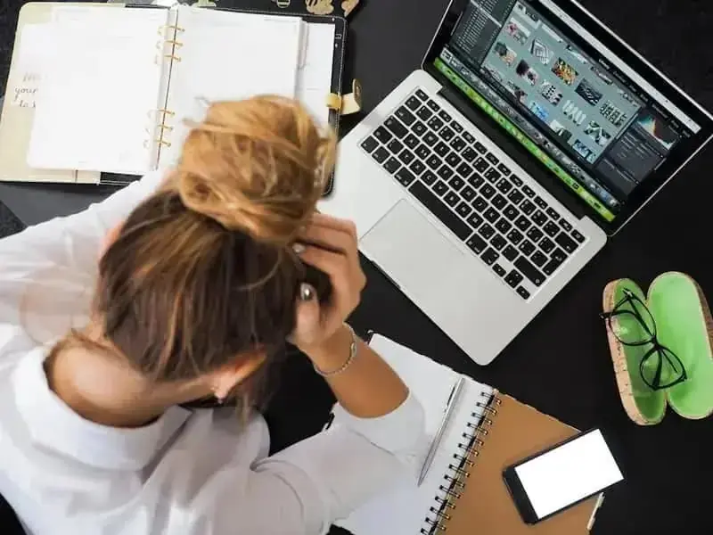 Stressed professional facing generic resume rejection screens